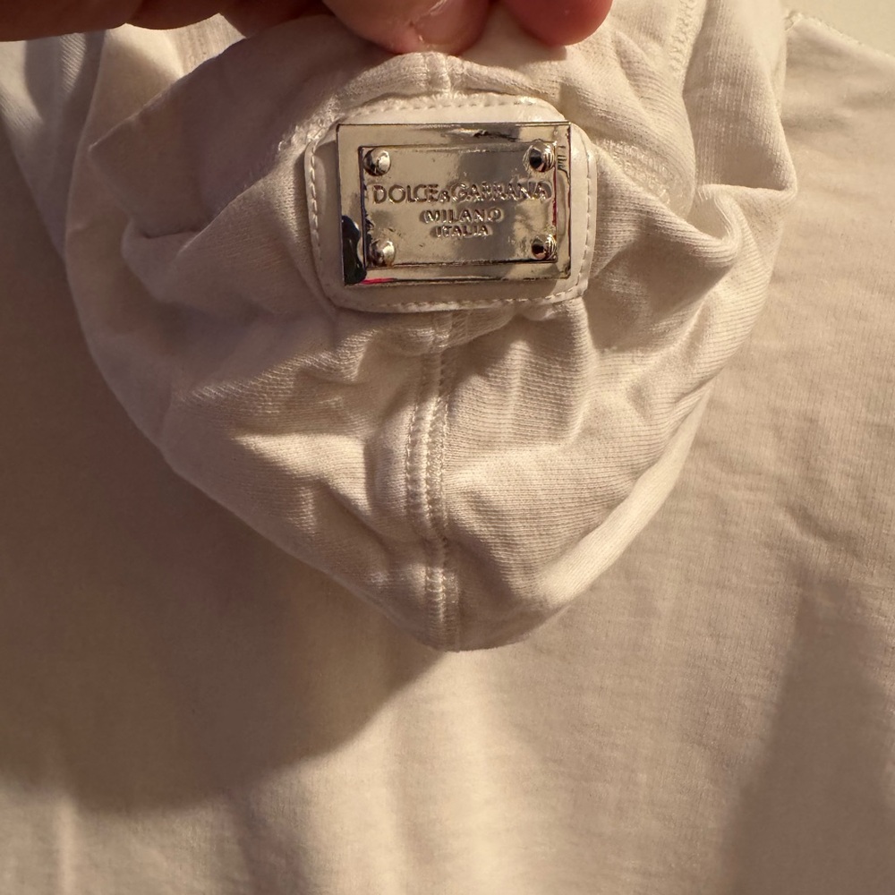 White Dolce Gabbana hoodie. Plaque detail on hoodie.